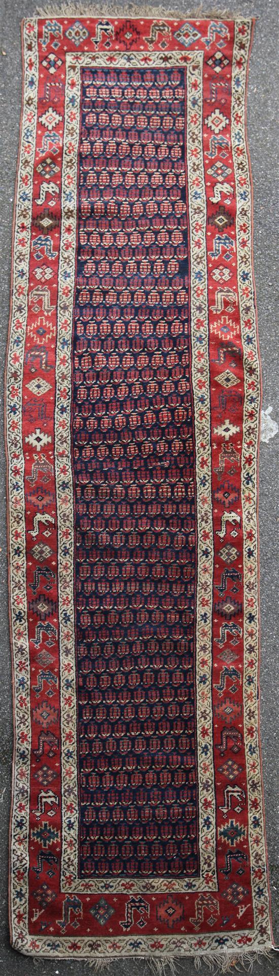 A North West Persian Senna design runner 12ft 10in by 3ft 5in.